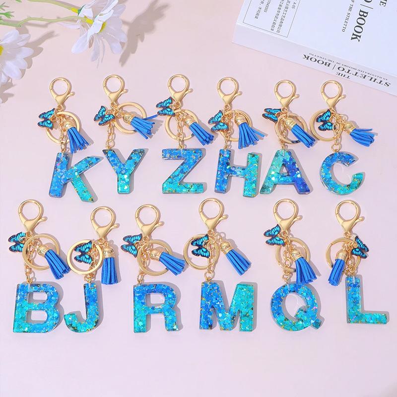 1 Stück Schriftzug Schlüsselanhänger für Rucksackanhänger Schlüsselanhänger Schlüsselring mit Quaste Schmetterling Niedlich Farbverlauf Harz Blau Pailletten