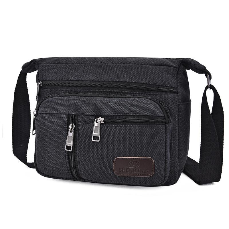 New large-capacity messenger bag men's sports travel going out shoulder bag casual multi-layer canvas bag toolkit