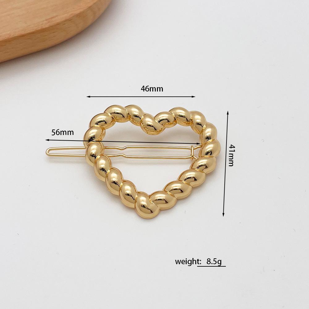 Elegant Heart-Shaped Frog Clip: Alloy Hair Accessory for Simple, Fashionable Styling - Women’s Temperament Hollow Bangs & Side Clip.