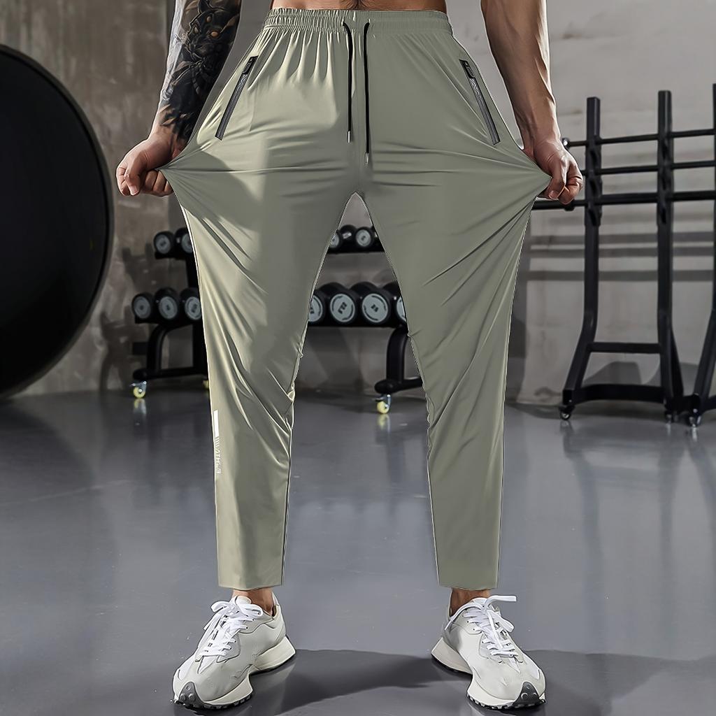 Herren Freizeit-Sporthose, Hochdehnbare Webware, Einfarbig, Normale Passform mit Kordelzugbund und Reißverschluss