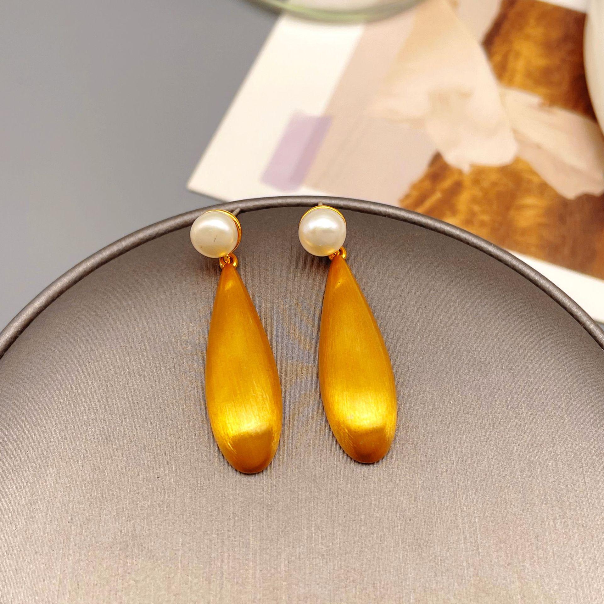 

Elegant French Teardrop Pearl Earrings with Brushed Metal Texture