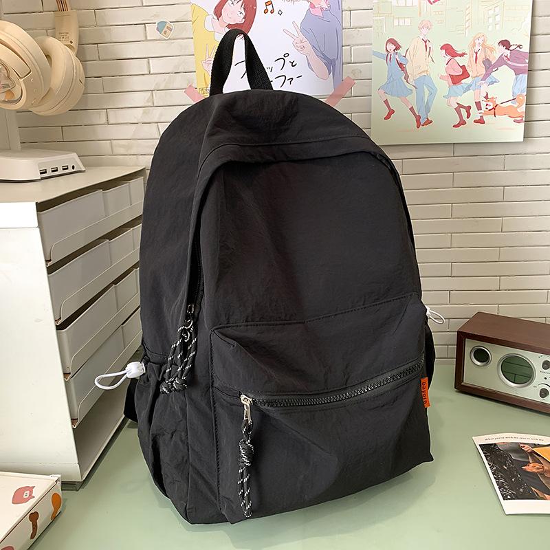 School bag solid color high-end female simple large school bag lightweight high school large capacity couple travel backpack