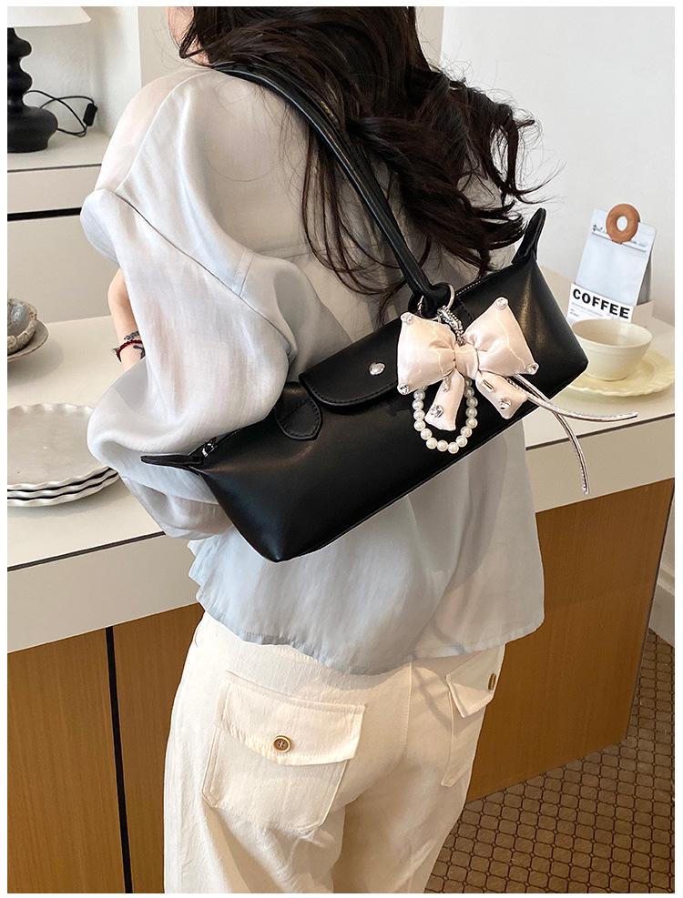 2026 French Light Luxury Cowhide Long Handle Dumpling Baguette Crossbody Bag