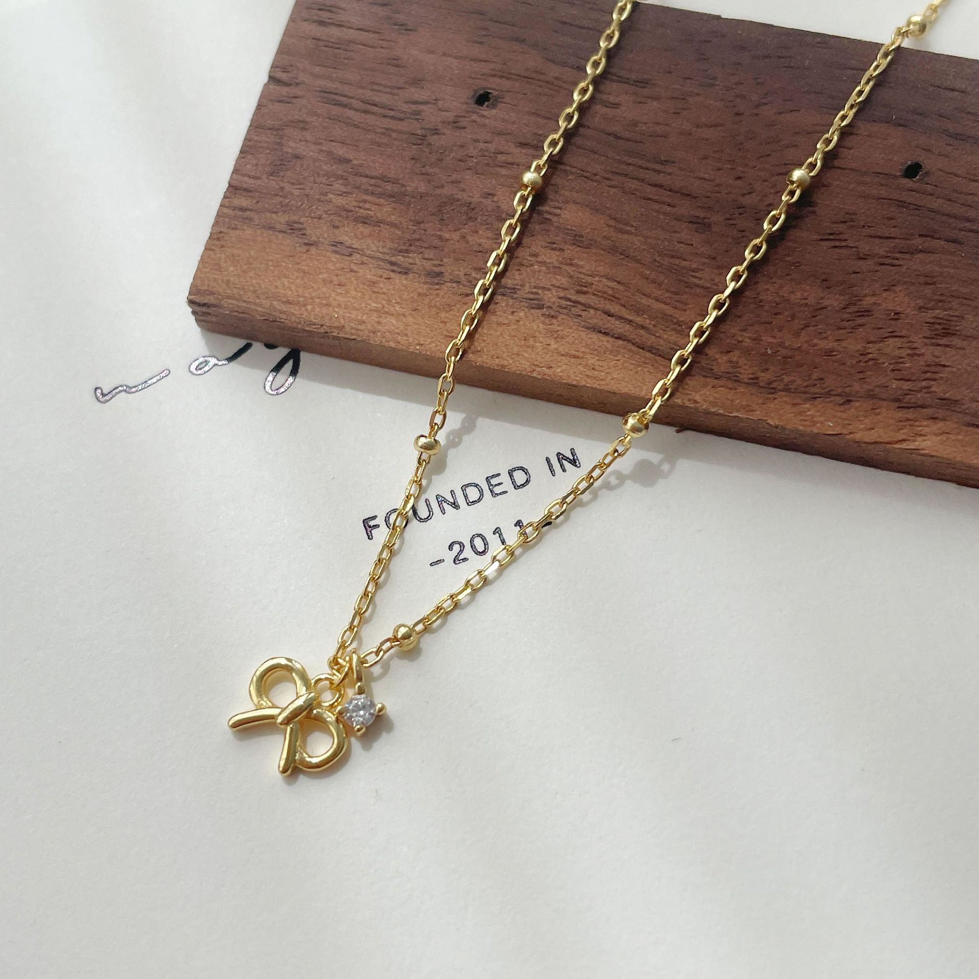 Korean version S925 sterling silver bow vertical zirconium necklace women s small exquisite small diamond collarbone chain 925 silver