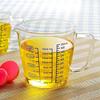 Heat-resistant measuring cup, milk glass, 500ml, with lid and handle. A convenient measuring cup made of heat-resistant glass, microwave and