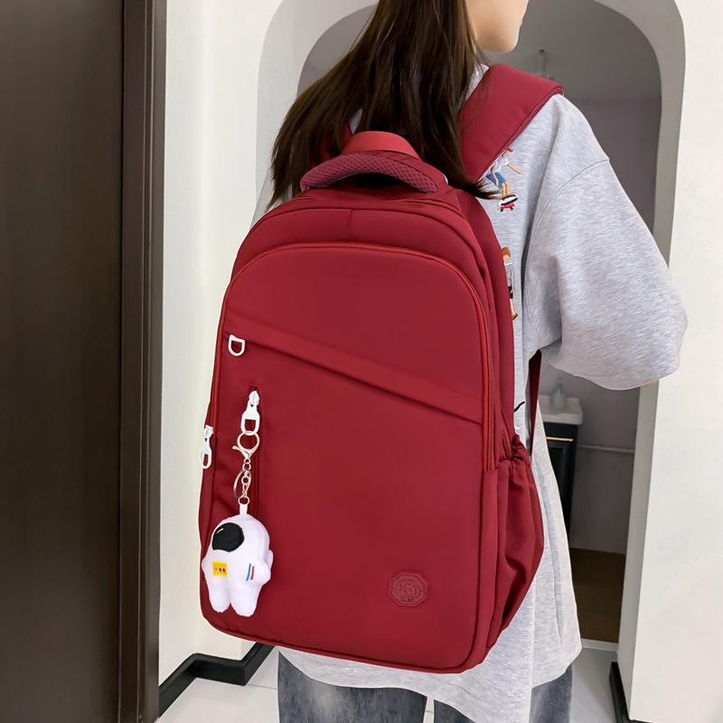 New student schoolbag, girls' large-capacity weight reduction, light solid color simple junior high school backpack
