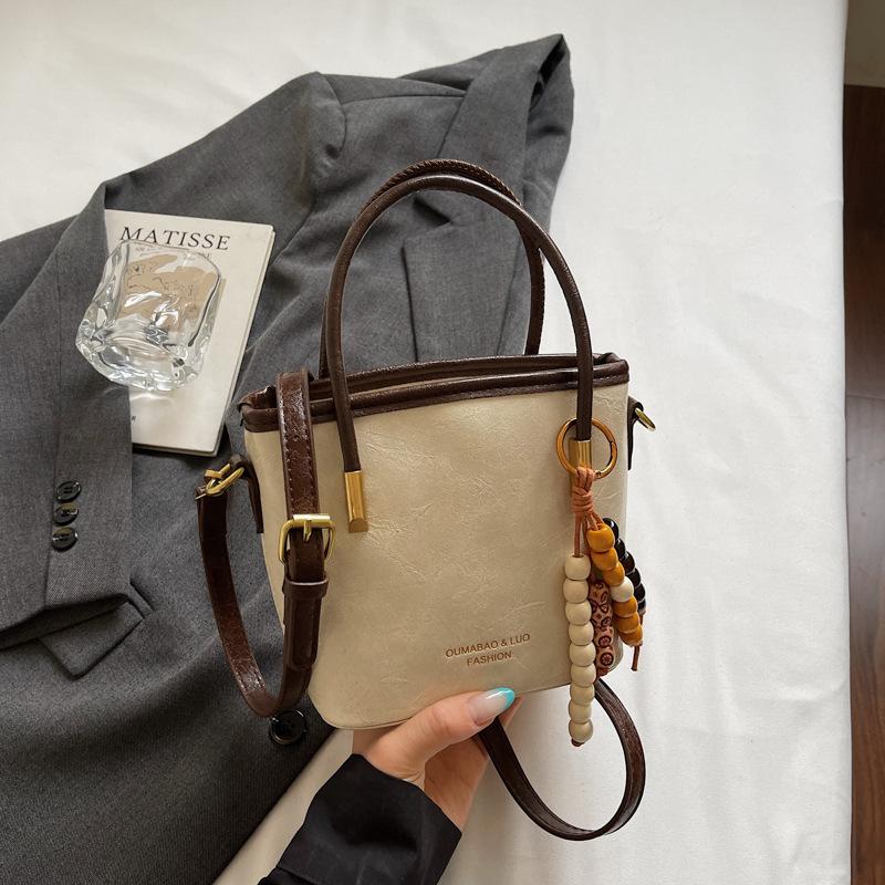 Casual retro small bag women's new fashion messenger bag commuter shoulder high value bucket bag