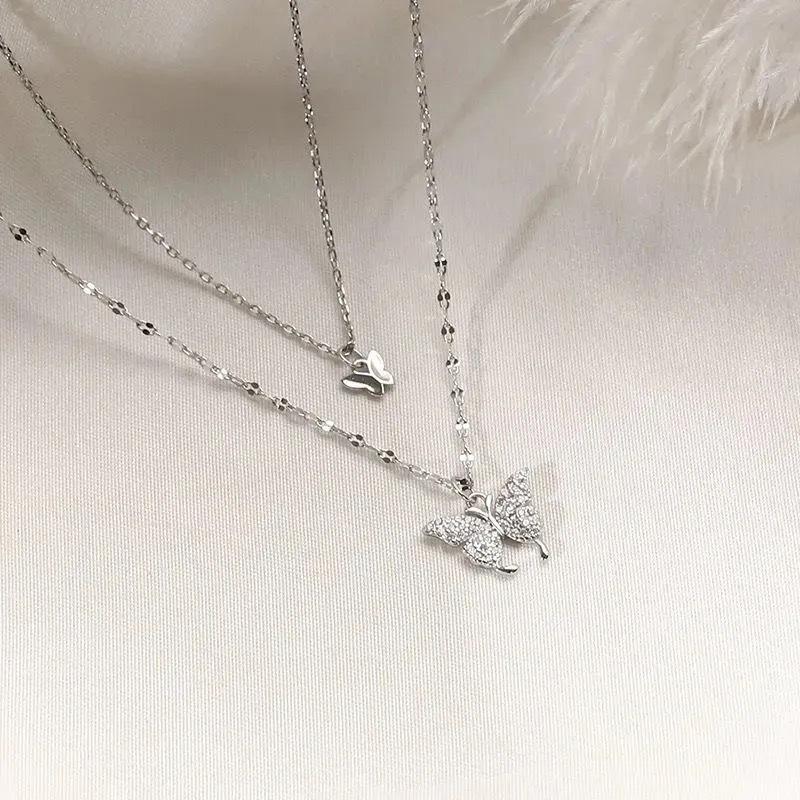 Doppellagige Schmetterlings-Schlüsselbeinkette: Eleganter Damen-Choker mit trendigem Nischen-Anhängerdesign  für 2024.