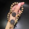 Golden Silk Phoebe Wood Bracelet with Ghost Flower Pendant - Unisex Cultural Prayer Beads