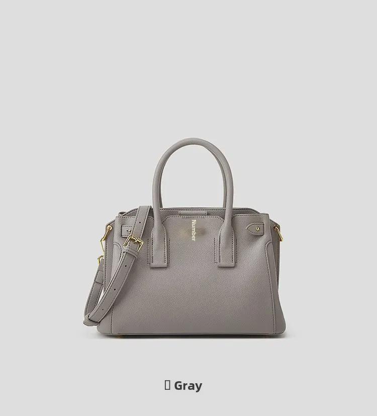 Chic Women's Tote Bag: Niche Design, Hand-Held Platinum, Large-Capacity, Fashionable Messenger Bag.