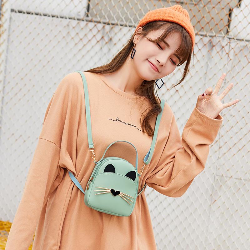 Trendy Women's 2021 Schoolbag: Multi-Function Backpack & Handbag for Phones and More.