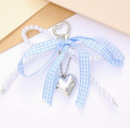 

- pearl bow bag charm