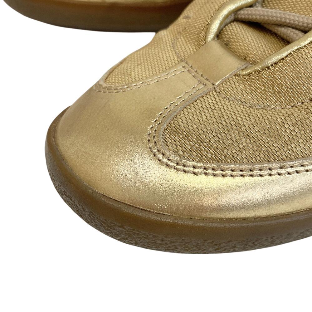 Gucci Niedrig geschnittene Leder-Sneaker goldfarbenes Leder Gebraucht