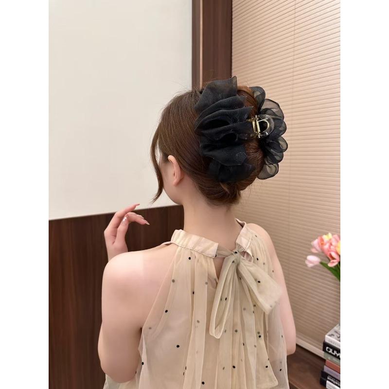 The Mesh Grabber Is Elegant and Feminine with A Lot of Hair On The Back of The Head. It Is A Shark Clip Hair Accessory