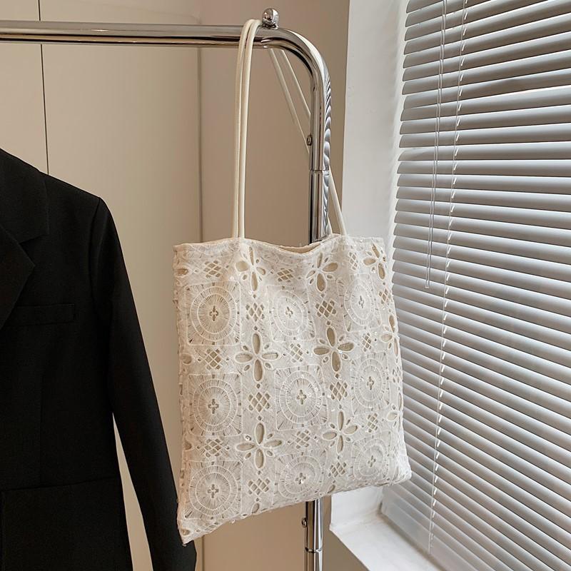 

Пляжный отдых нишевая полая плетеная сумка женская летняя новая большая вместительная сумка-тоут