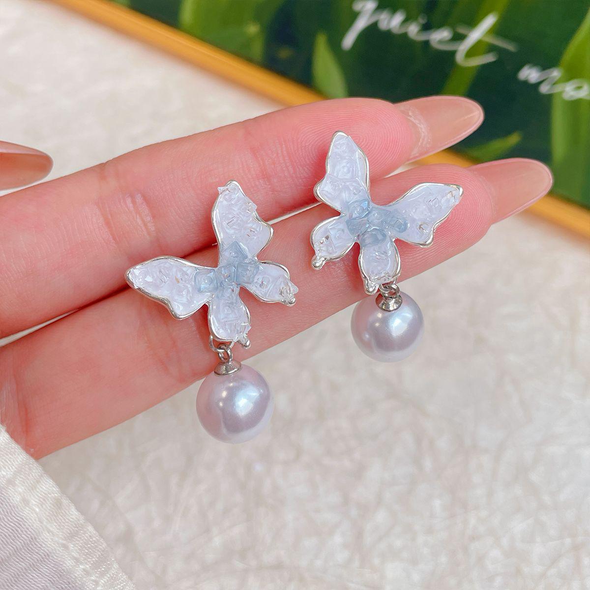 

Синие серьги-пусеты с кристаллами в виде банта на серебряной игле - Роскошный дизайн с подвесками высокого класса