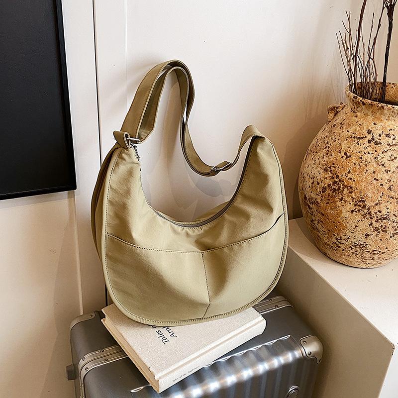 Canvas bag women's large-capacity new niche design sense summer shoulder messenger bag versatile commuter dumpling bag
