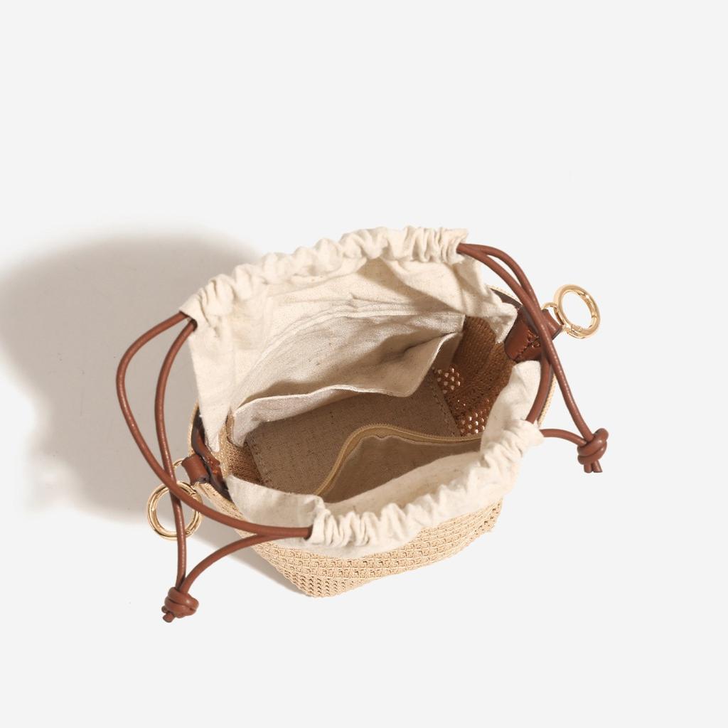 Drawstring bucket bag 2025 summer new casual vacation woven beach bag niche texture versatile shoulder crossbody bag