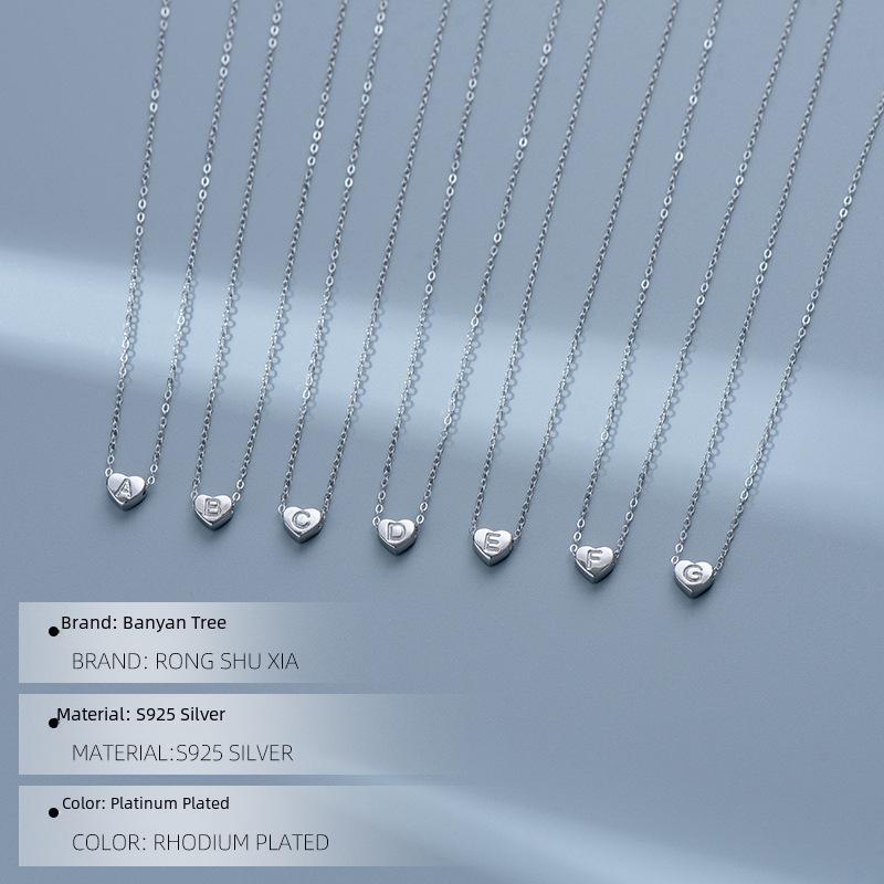 S925 Silver Heart-Shaped Initial Necklace - Korean Style Clavicle Chain with Trendy Peach Heart Design.