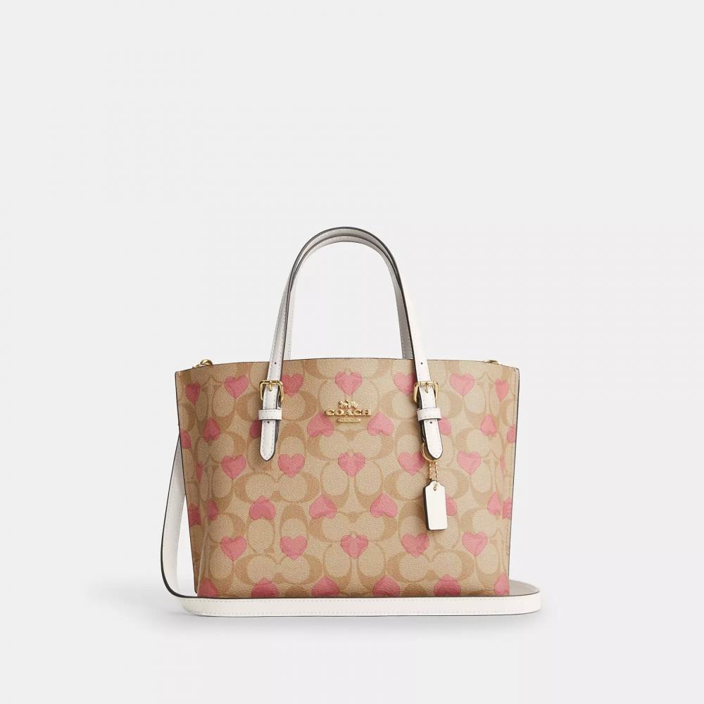 

Сумка-тоут Coach Mollie 25 из фирменной канвы с принтом в виде сердечек