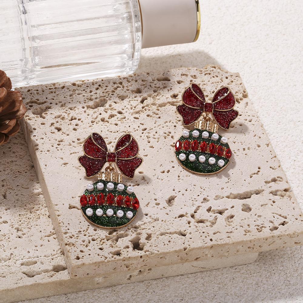 

Темпераментные рождественские серьги-подвески с жемчужным шариком, бантом и цветным фонариком