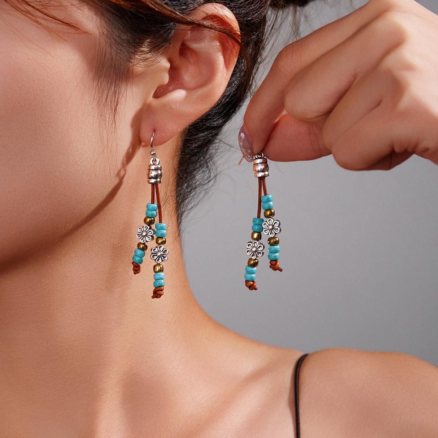

Fashionable retro turquoise bead flower leather rope woven tassel environmentally friendly women s earrings