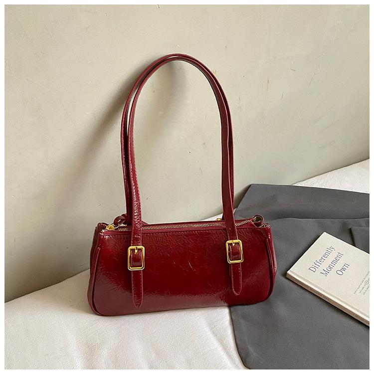 

Премиальная ретро маленькая сумка подмышку женская 2025 новая модная нишевая дизайнерская сумка через плечо кожа с масляной восковой пропиткой сумка для通勤 красный