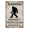 Tin Sign Warning Property Protected By Sasquatch Funny Rustic Metal Plaque   Vintage Wall Decor for Cabin Lodge Man Cave Garage