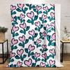 Pink heart-shaped flowers with teal leaves on a white background. for all seasons blanket lunch break throw gift