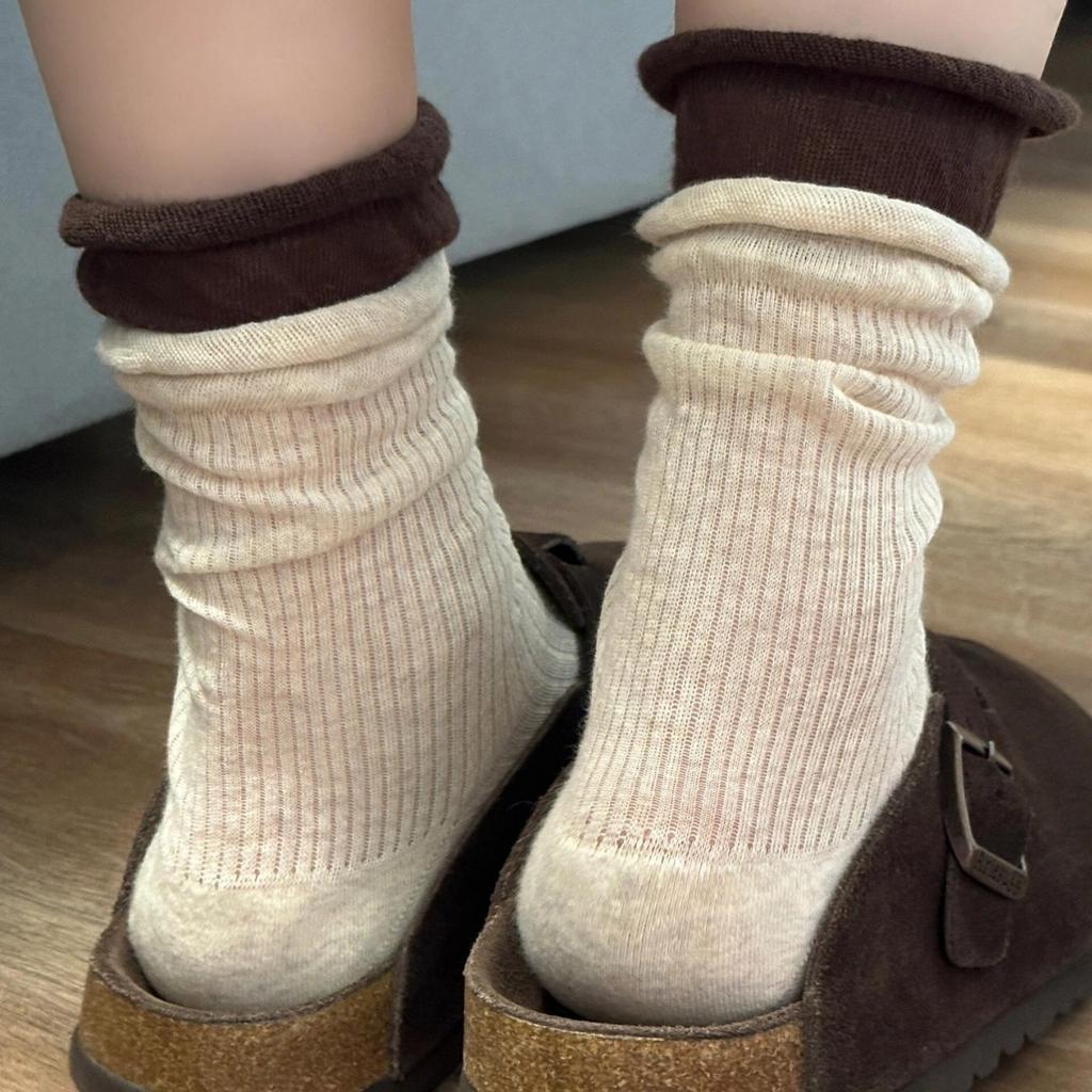 Grey Socks with Rolled-up Edges, Piles of Socks, Burken Shoes, Mid-calf Socks, and Contrasting Long Socks Are Trendy