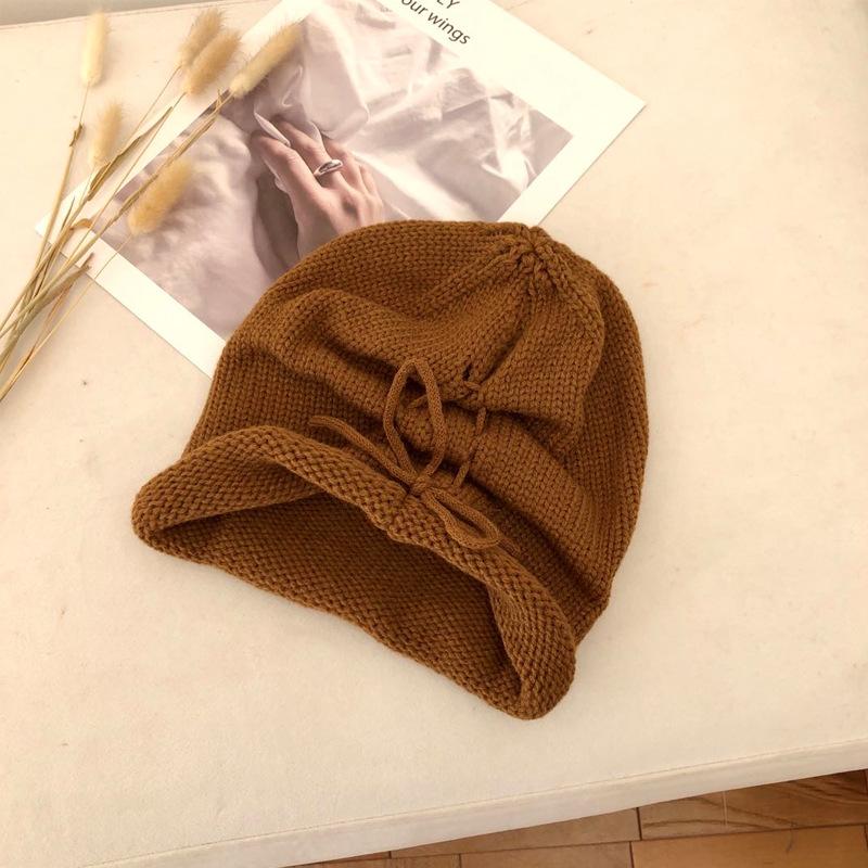 Autumn and winter solid color warm crimped wool hat men's and women's versatile knitted hat fashion street drawstring stacking hat