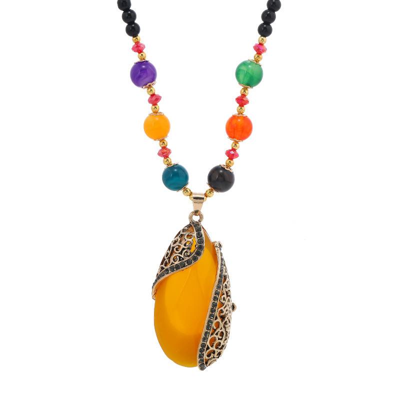 Semi-Encased Water Drop Pendant Necklace with Multi-Beaded Chain and Decorative Metal Frame for Everyday Wear and Special Occasions