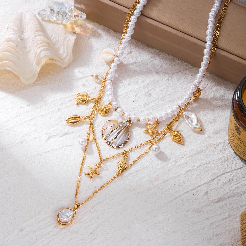 Bohemian Handgefertigter Seestern Sonne Anhänger Halskette für Damen Sommer Muschel Imitation Perle Reiskorn Perlen Choker Strandurlaub Schmuck