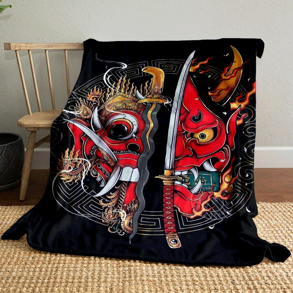 Fiery red demon masks split by swords, surrounded by ornate golden designs. for all seasons blanket lunch break throw gift