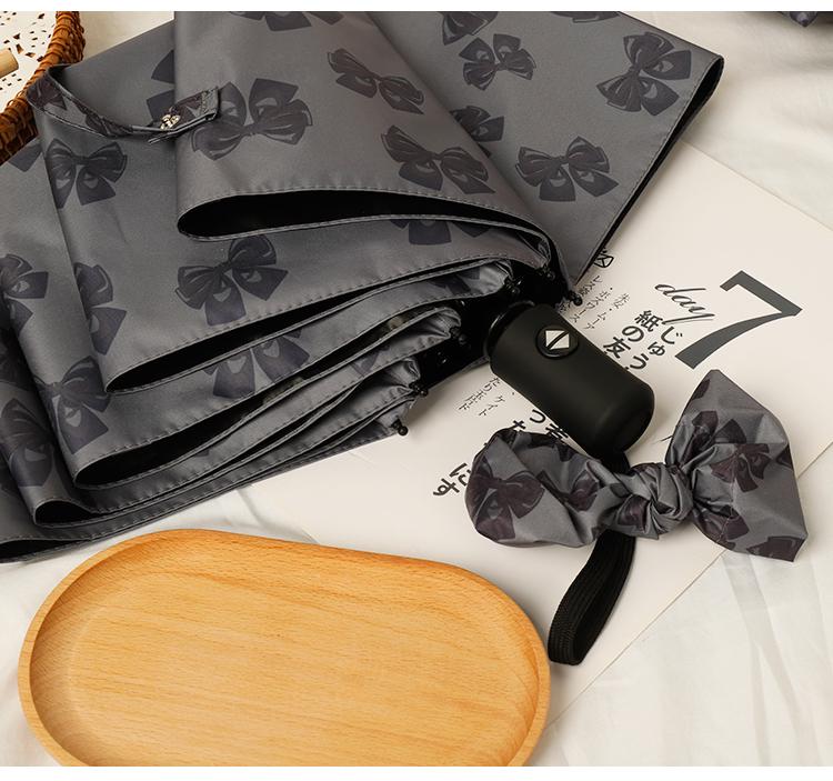 Women's Bow Sun & Rain Dual-Use Automatic Folding Umbrella - Compact, Fresh Sunshade with Black Glue for Sunscreen Protection.