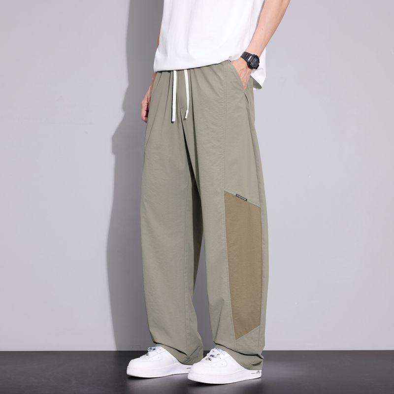 Spring and summer new scimitar loose straight ice silk contrasting color splicing black casual pants men's very light pants