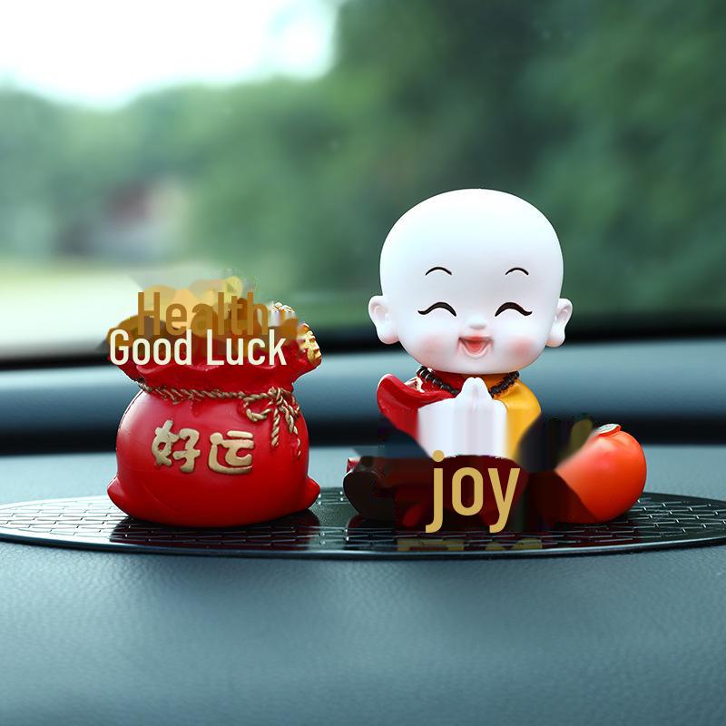 Creative Little Monk Maitreya Buddha Car Ornament: Cute, Shaking Head Resin Doll for Car Interior Decoration and Safety.