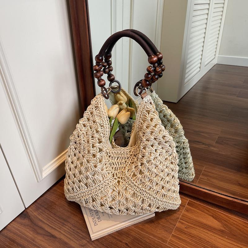 Hohle Stroh gewebte Tasche Damen neue Sommer Schulter Tragetasche Strandurlaub Strand gewebte Tasche