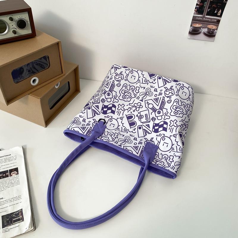 

Korean ins niche Harajuku retro graffiti tote bag student class commute large capacity versatile women s shoulder bag Single pack фиолетовый