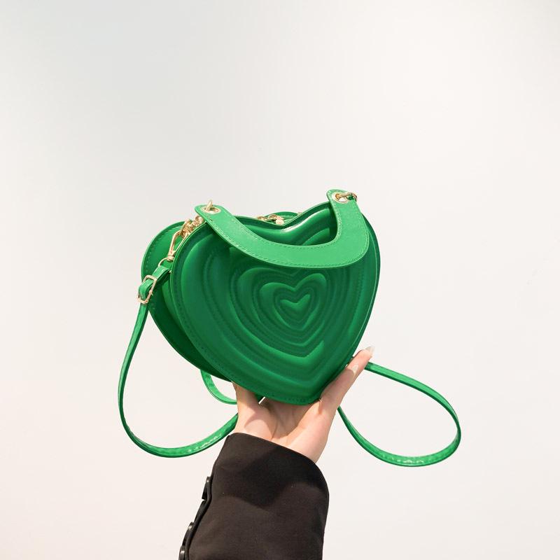 

Женская сумочка в форме сердца конфетного цвета на весну/лето 2024: Сладкая и модная маленькая сумка зелёный