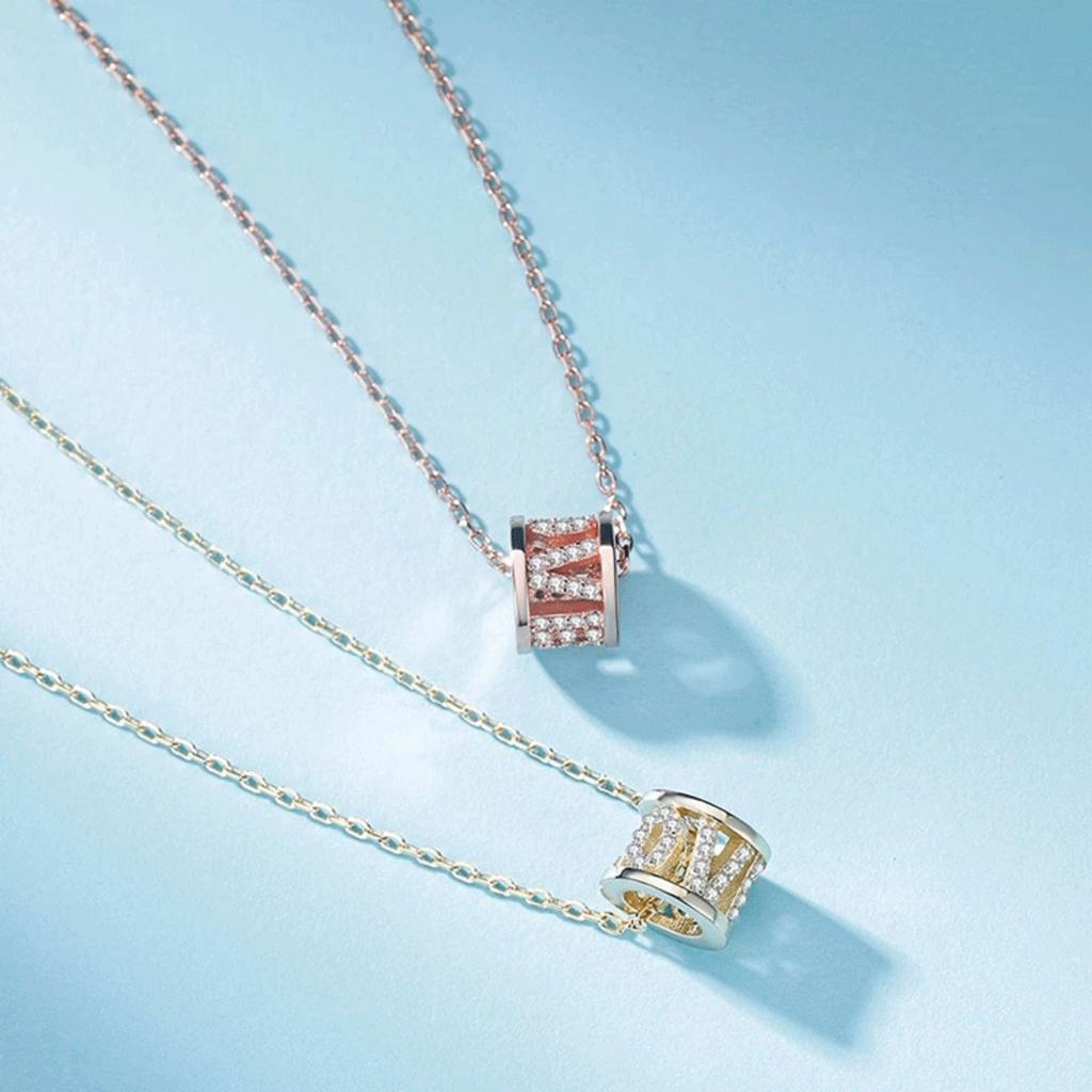 Sparkling Barrel Pendant Necklace with Textured Inlay and Central Ring Detail Modern Elegant Jewelry for Women