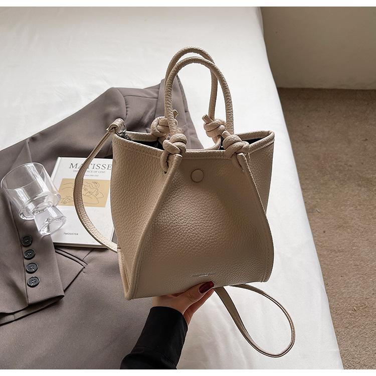 2025 spring and summer new fashion high sense simple solid color bucket bag versatile temperament women's commuter messenger bag