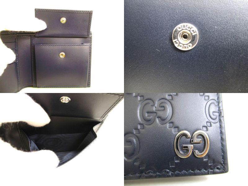 Autentyczny portfel GUCCI GG Metal Guccissima Granatowy Skórzany Podwójnie Składany #9947 Otwarte pudełko