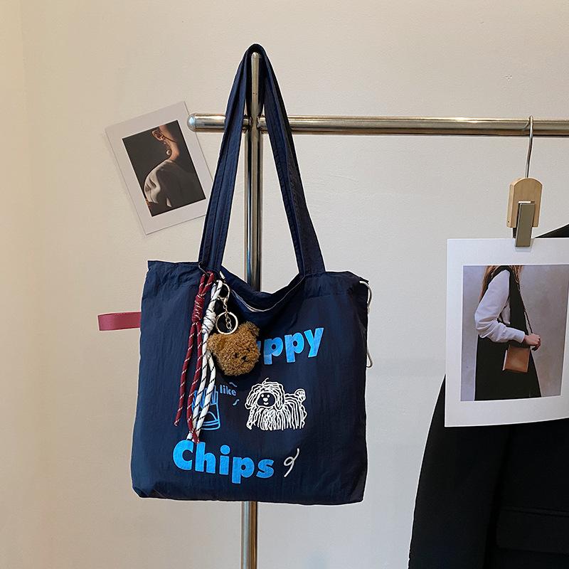 

Leisure commuting large-capacity tote bag, new women s bag, fashionable canvas, portable shoulder oblique span bag, student tide single package синий