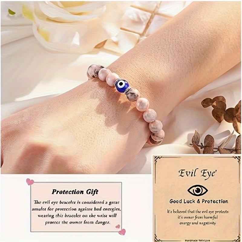 Handgefertigtes Armband aus rosa Natursteinperlen mit einzigartigen blauen Perlen in Teufelsaugenform, exquisiter Schmuck zum Anfassen