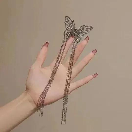 2025 New Super Immortal Hollow Butterfly Tassel Women's Grab Clip Half Tie Hair Fashion Girl Pearl Pendant Hair Card Shark Clip