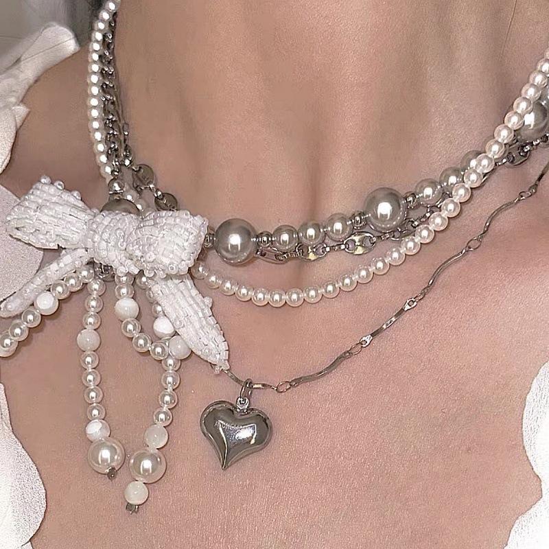 

Милый дизайн многослойное жемчужное ожерелье с подвеской в виде банта и сердца женское легкое роскошное темпераментное нишевое ожерелье-цепочка на ключицу