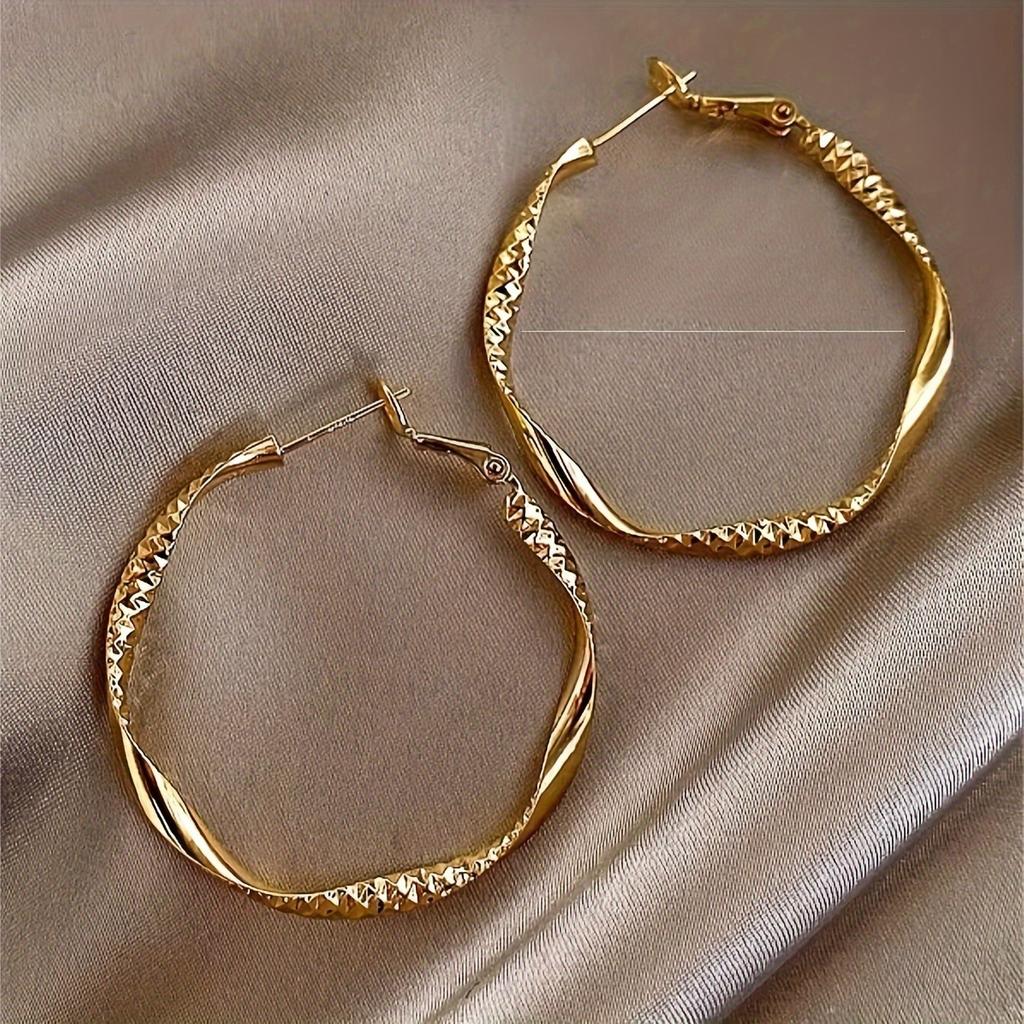 Fashionable and simple round twisted irregular ladies earrings exaggerated girls earrings high-grade plain hoop earrings