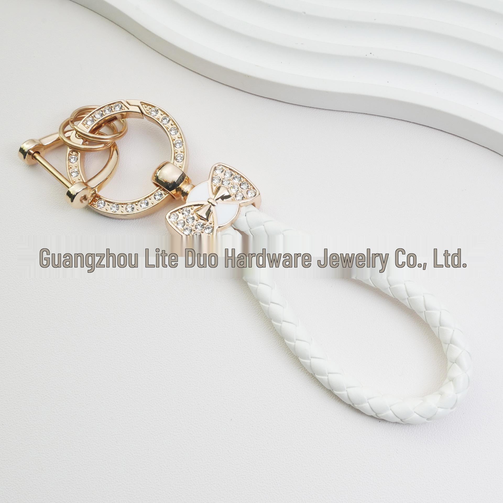 

Rhinestone Horseshoe Keychain: Hand-woven Rope with Zinc Alloy Pendant, Anti-Lost Ring, Fashionable Car Key Accessory. Elegant Bow