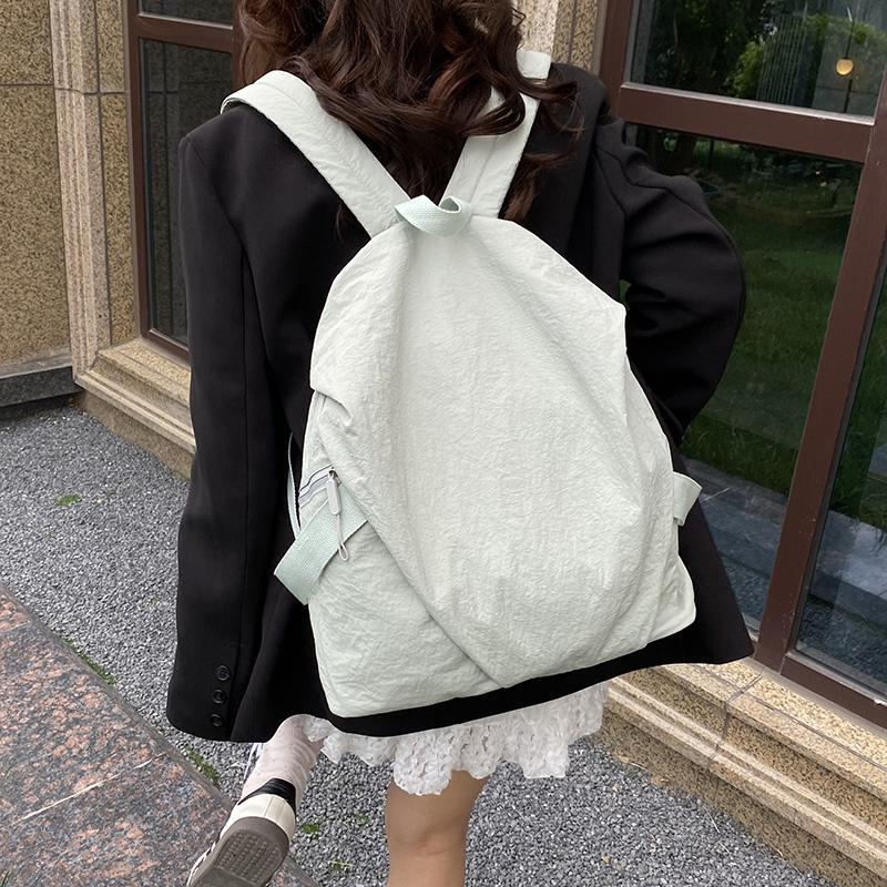Schoolbag High-value backpack Women's simple solid color casual versatile backpack Light commuter travel bag Male college student schoolbag